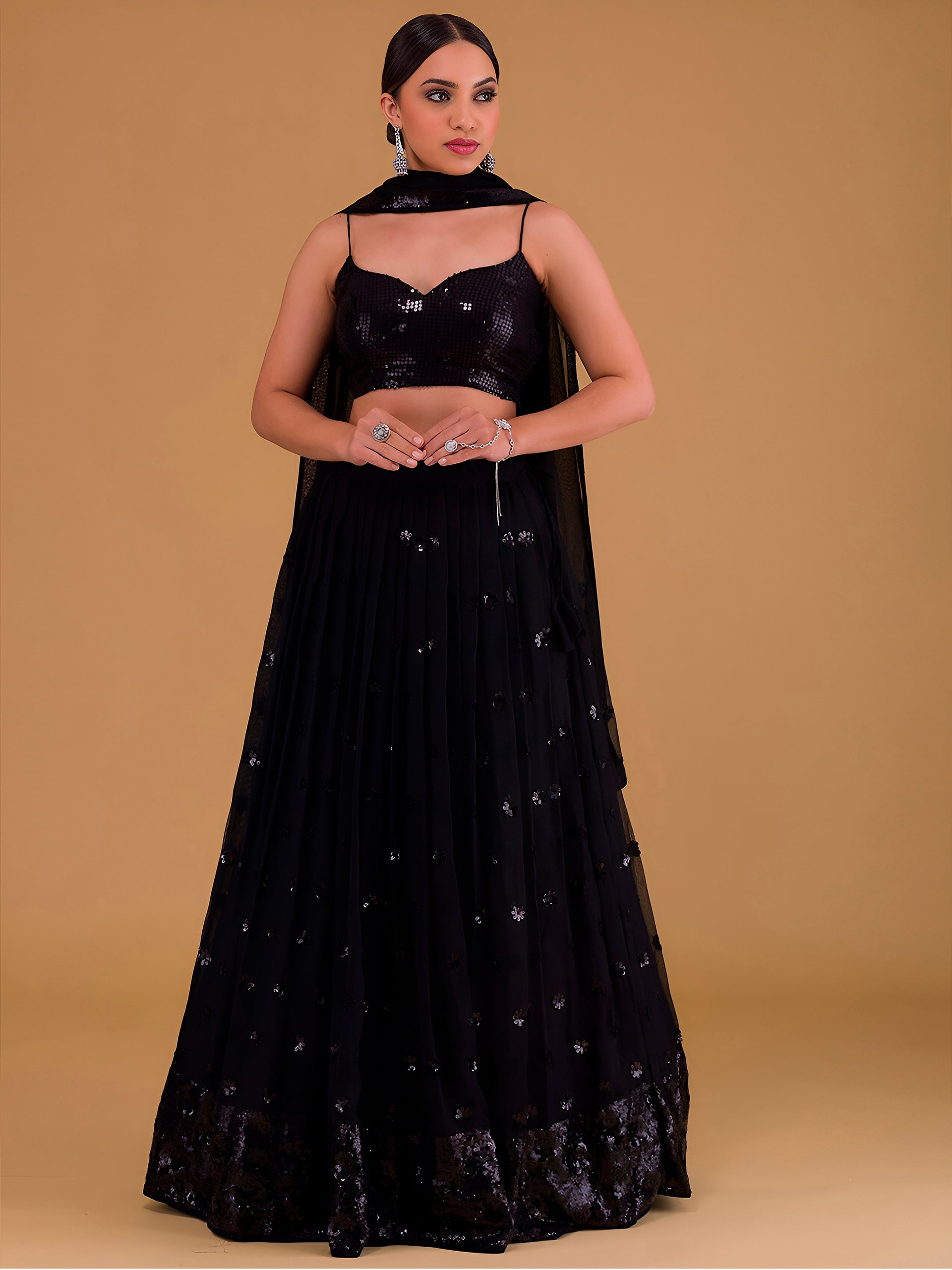 This outfit is a Black Georgette lehenga - Black
