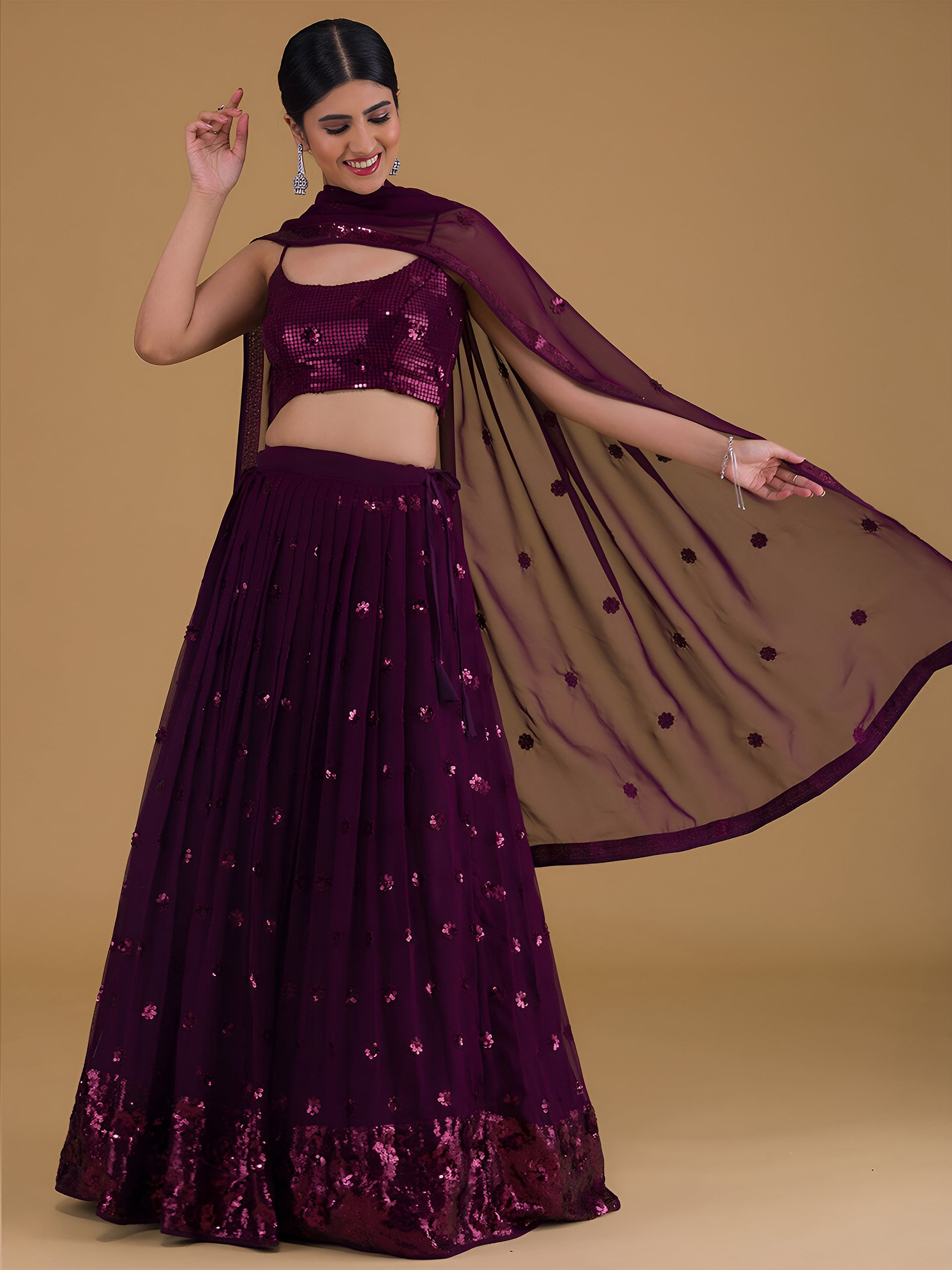This outfit is a Black Georgette lehenga - Purple