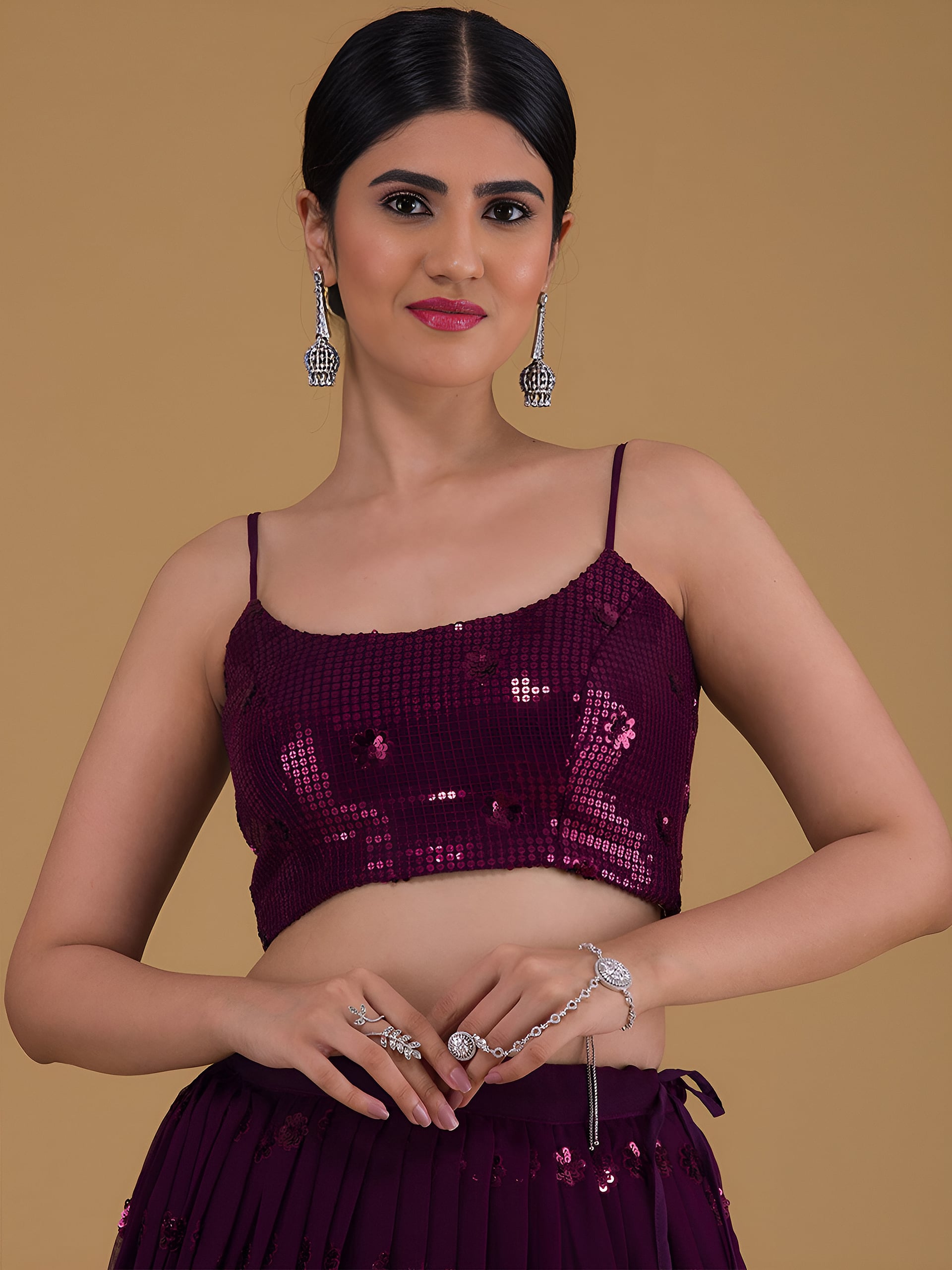 This outfit is a Black Georgette lehenga - Purple