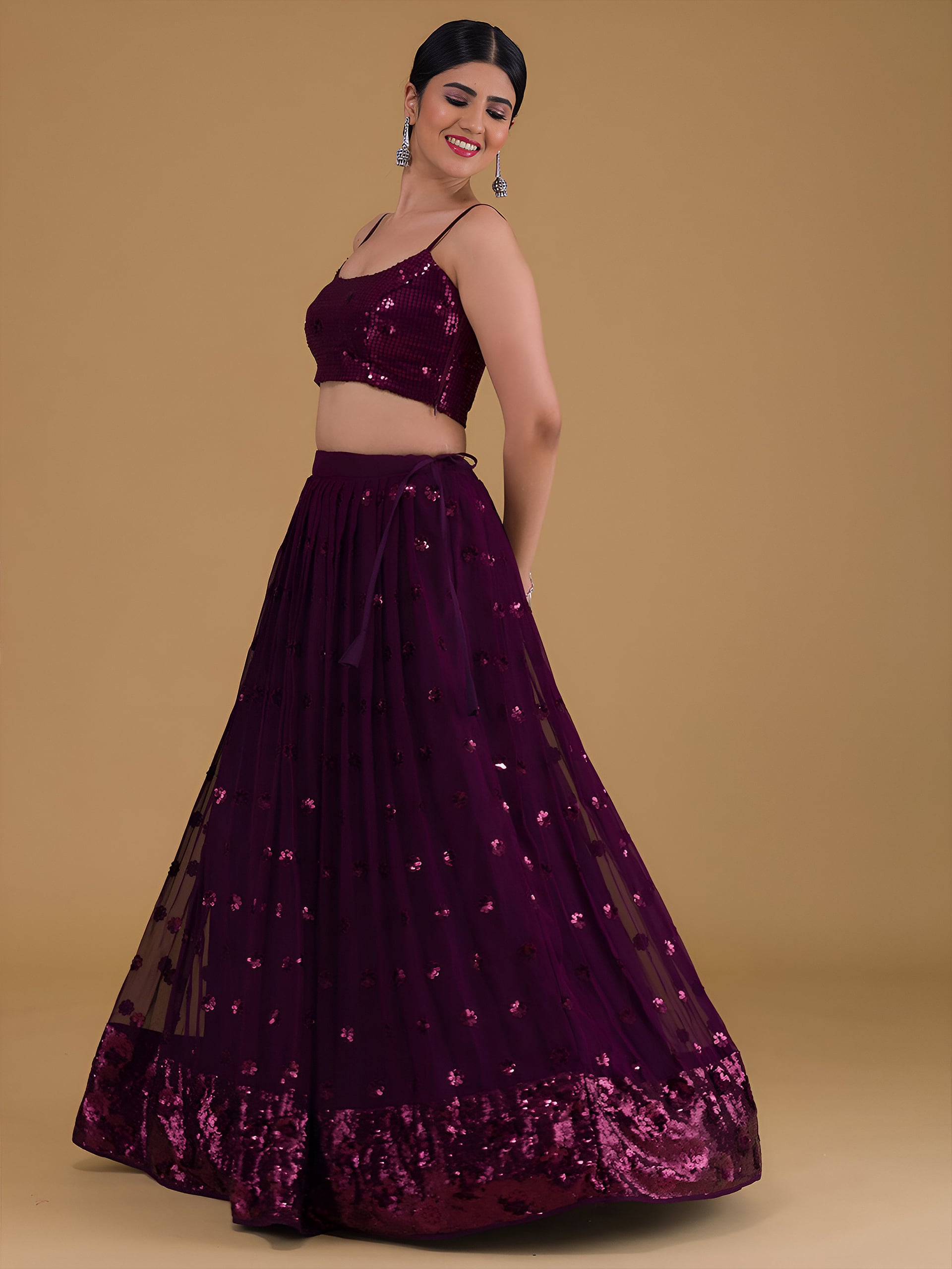 This outfit is a Black Georgette lehenga - Purple
