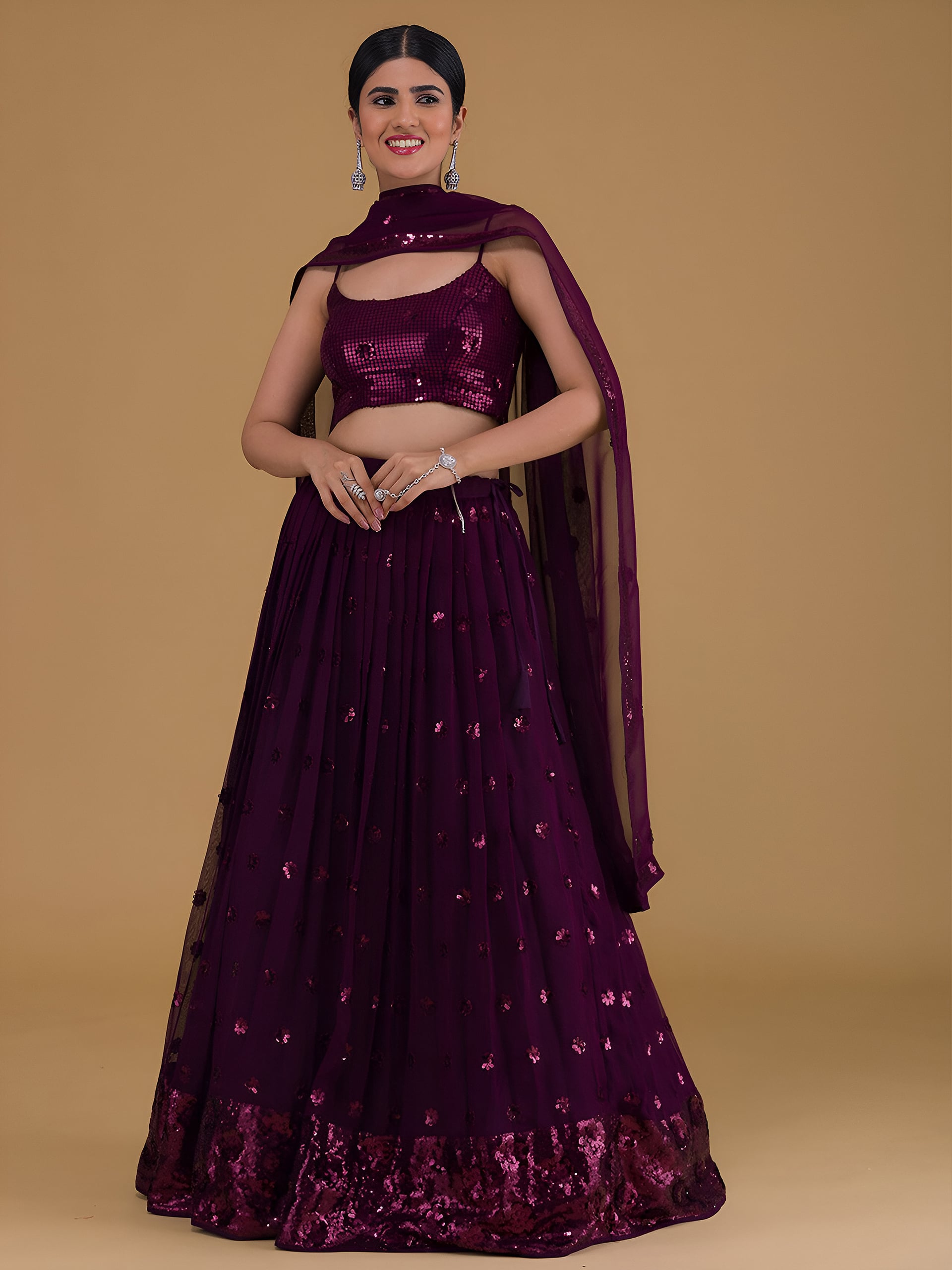 This outfit is a Black Georgette lehenga - Purple