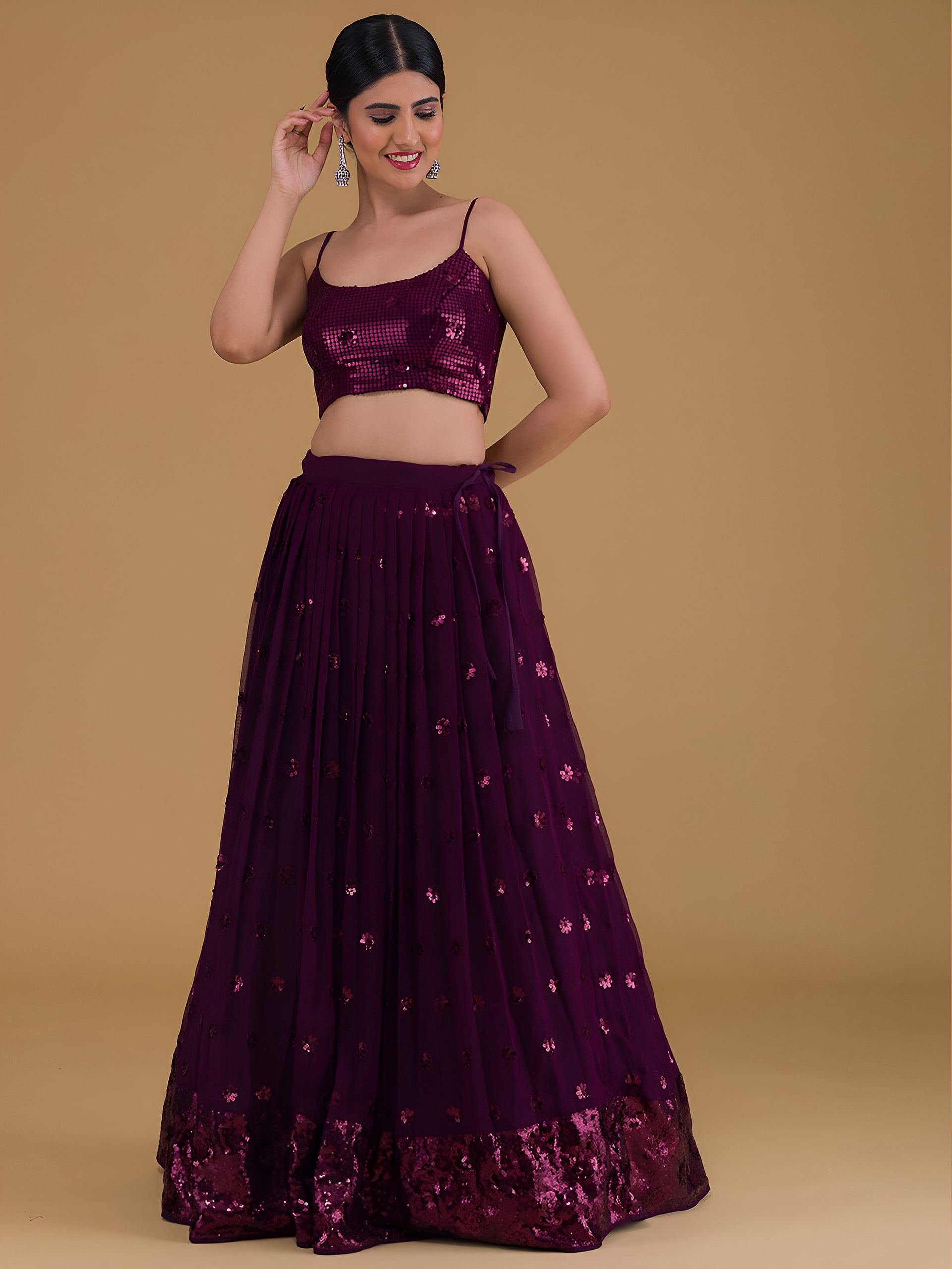 This outfit is a Black Georgette lehenga - Purple