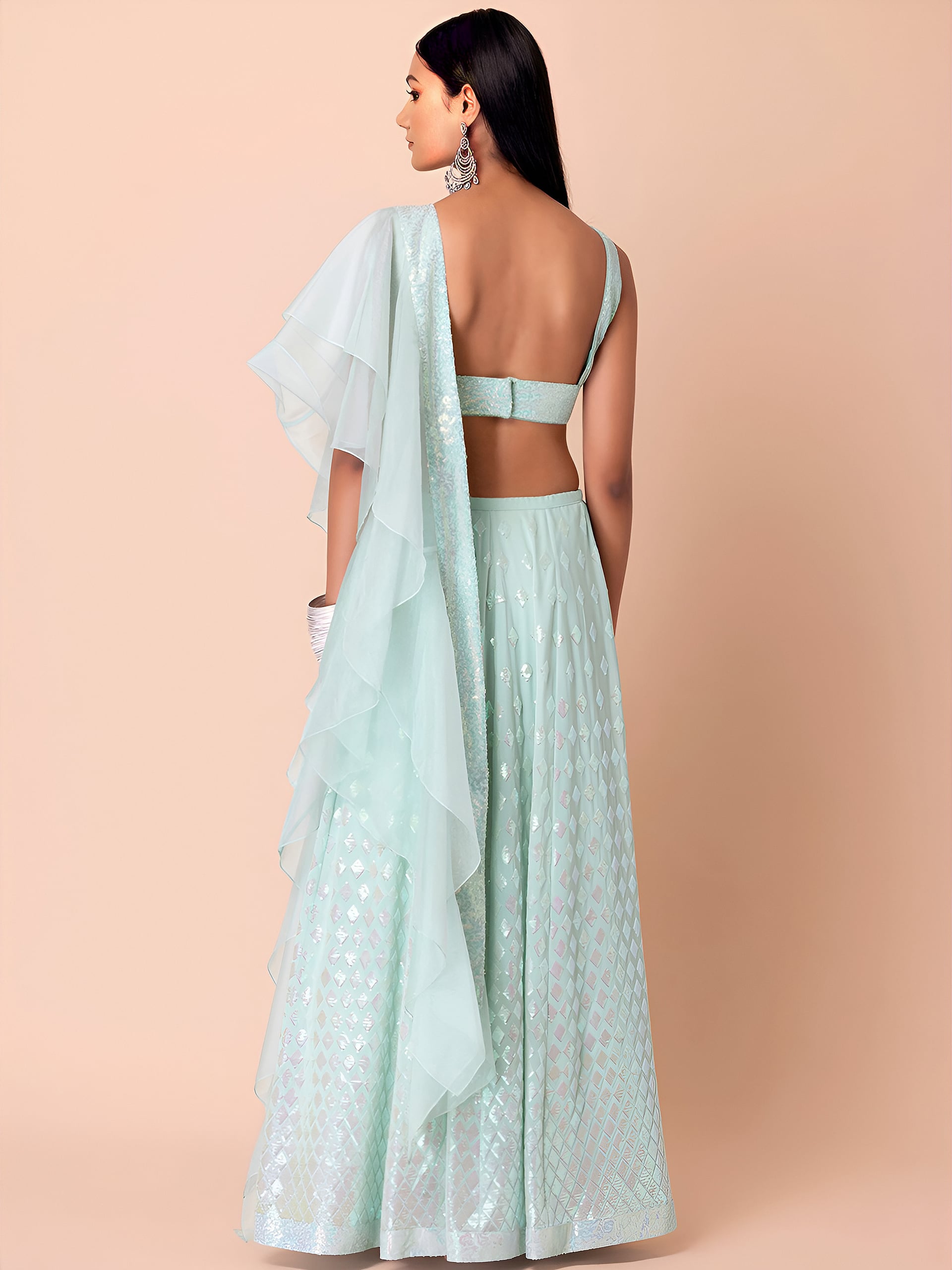 This outfit is a Black Georgette lehenga - Blue