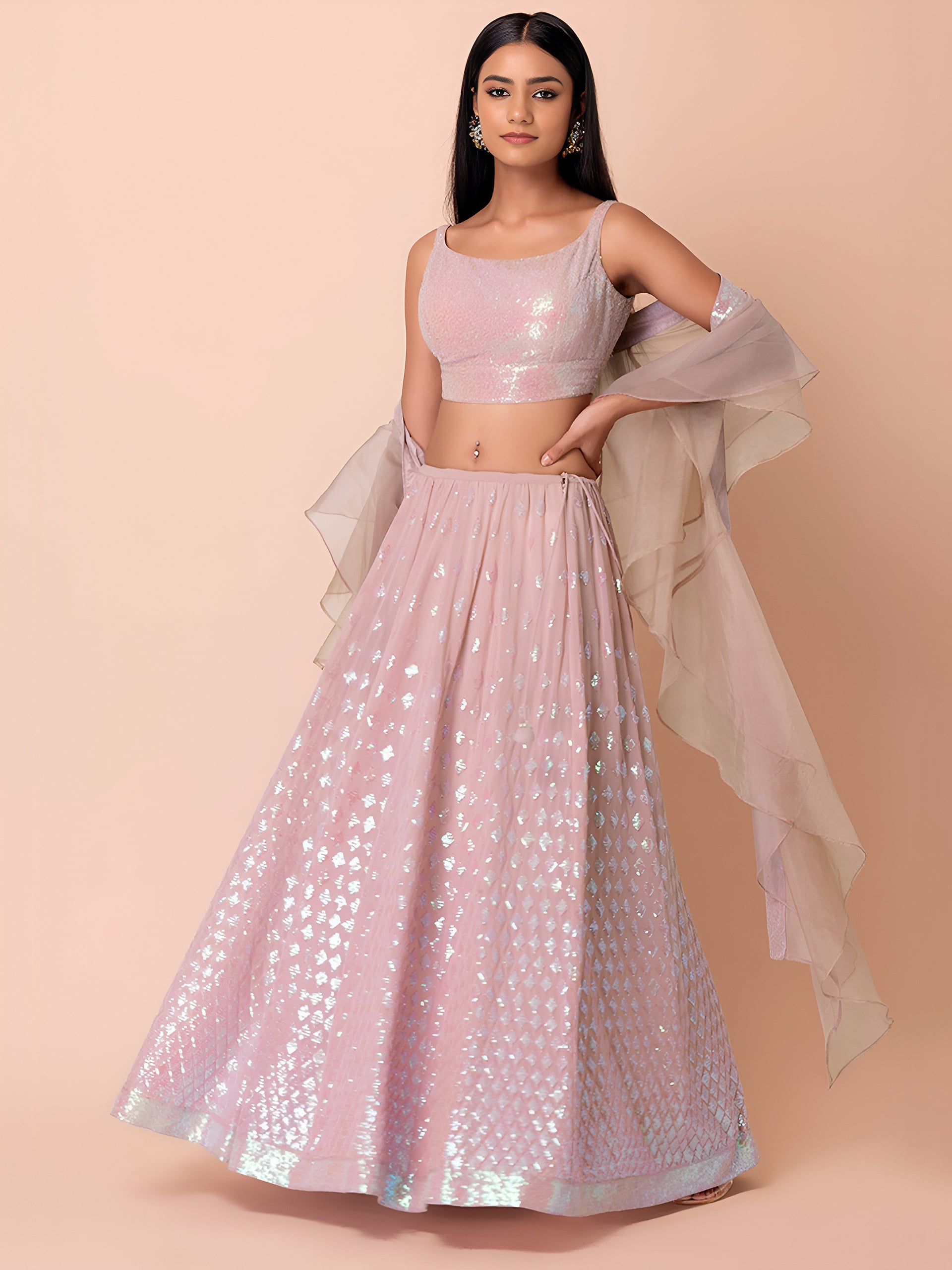 This outfit is a Black Georgette lehenga - Pink