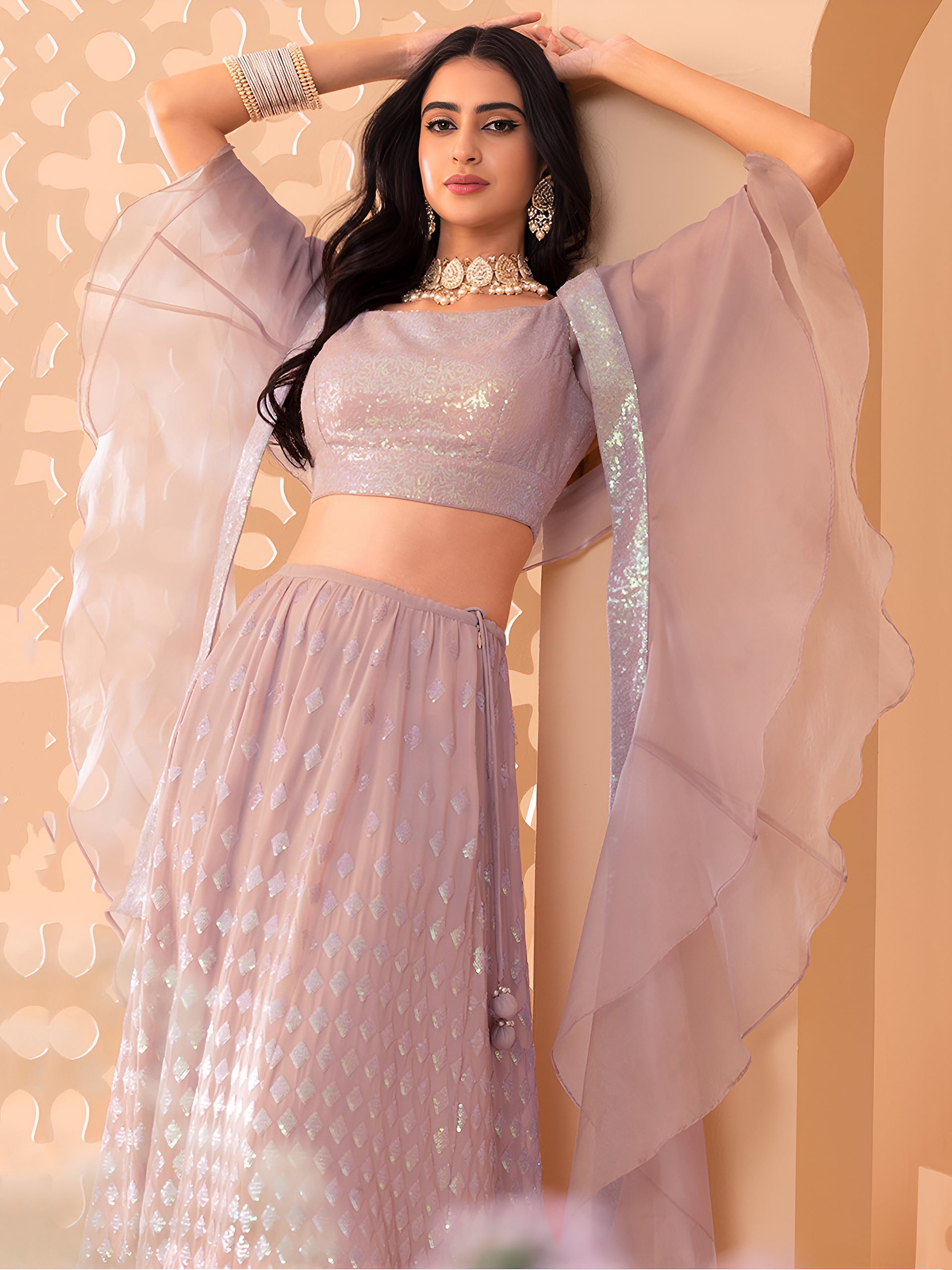 This outfit is a Black Georgette lehenga - Pink
