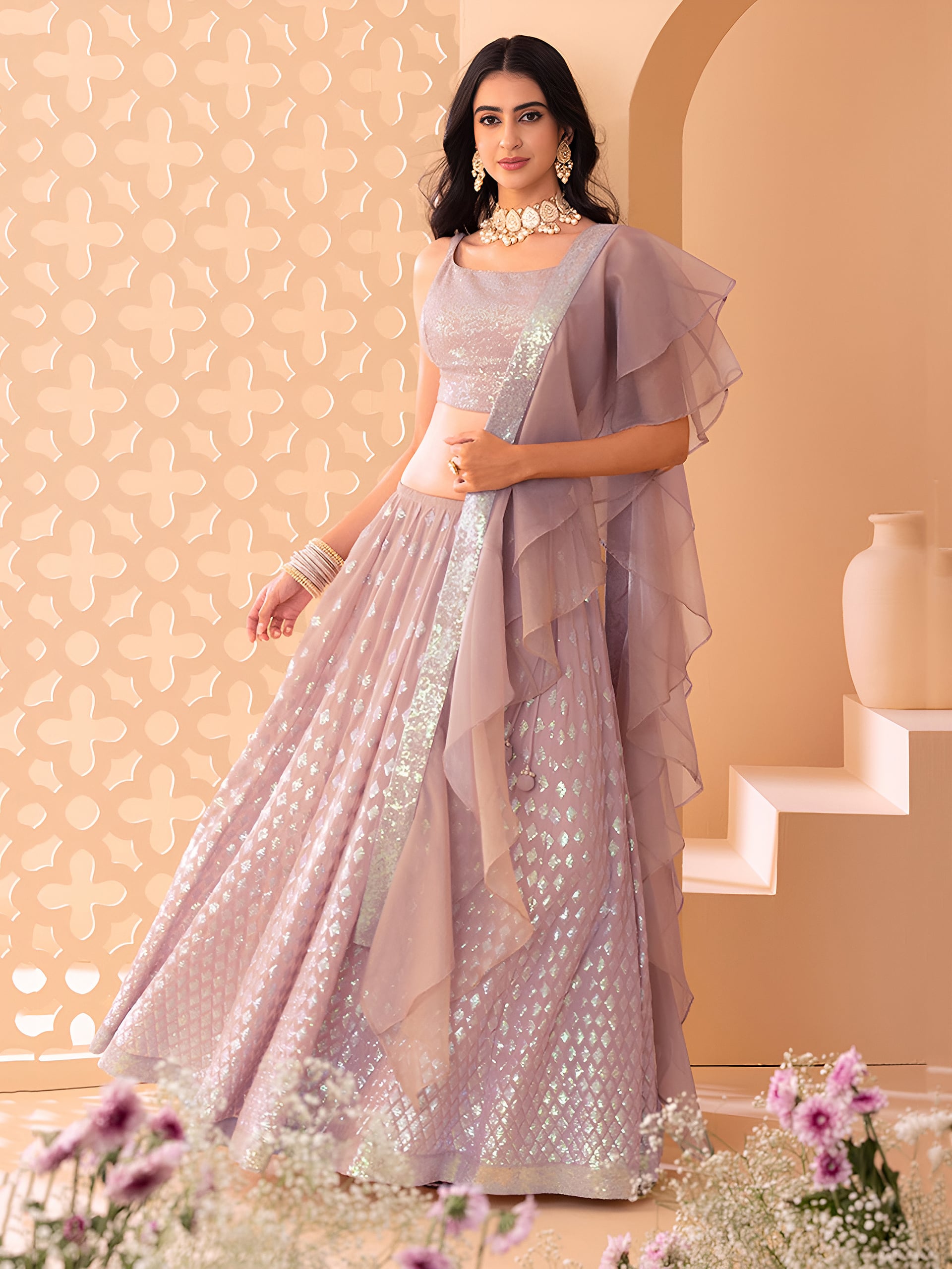 This outfit is a Black Georgette lehenga - Pink